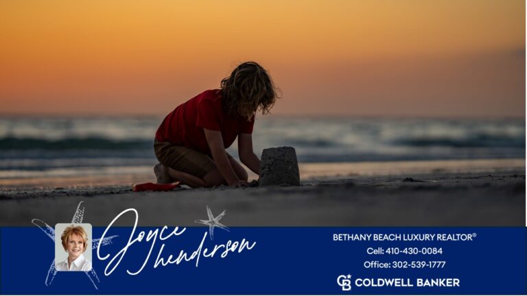 Image of a child building a sandcastle on Bethany Beach in front of his parent's luxury home at sunset