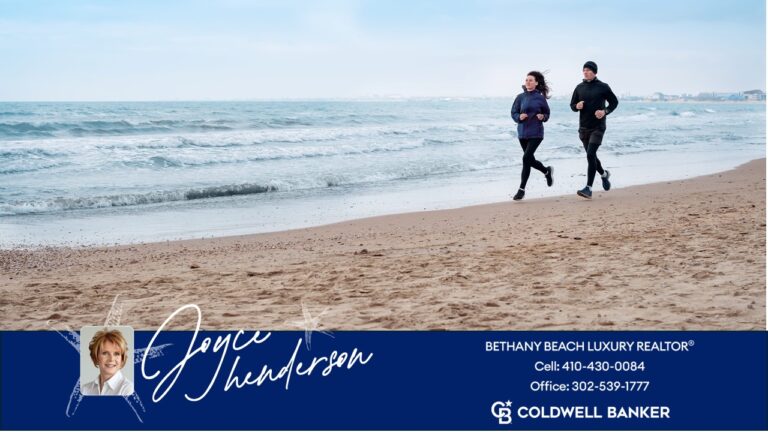 image of couple running on the sand next to the ocean in Bethany Beach near luxury homes